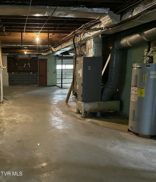 201 Brown St, Appalachia, VA 24216 - basement with electric water heater and heating unit