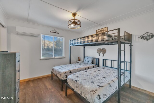 136 Beecher Holtsclaw Rd, Roan Mountain, TN 37687 - bedroom featuring an AC wall unit, crown molding, wood finished floors, and baseboards