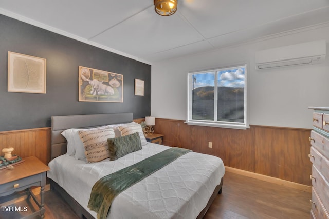 136 Beecher Holtsclaw Rd, Roan Mountain, TN 37687 - bedroom featuring an AC wall unit, a wainscoted wall, wood finished floors, wooden walls, and ornamental molding