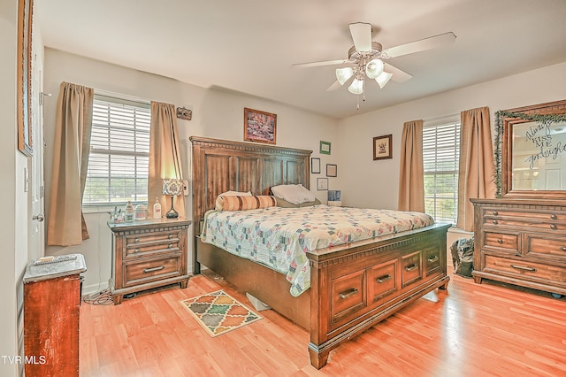 1495 Fishpond Rd, Chuckey, TN 37641 - bedroom featuring light wood-type flooring, multiple windows, and ceiling fan