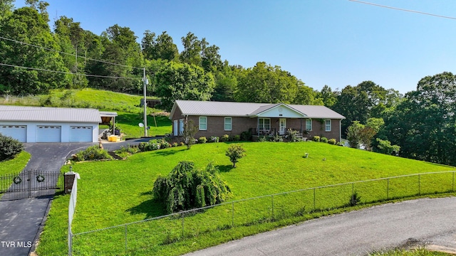 1495 Fishpond Rd, Chuckey, TN 37641 - single story home featuring a garage, an outdoor structure, metal roof, and driveway
