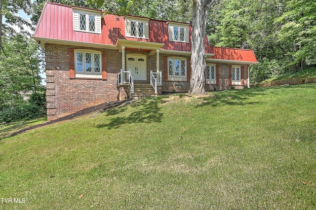 505 Red Oak Ln, Kingsport, TN 37663 - view of front of house featuring brick siding, a metal roof, and a front lawn