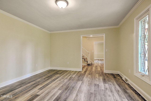505 Red Oak Ln, Kingsport, TN 37663 - empty room with wood finished floors, stairway, and crown molding