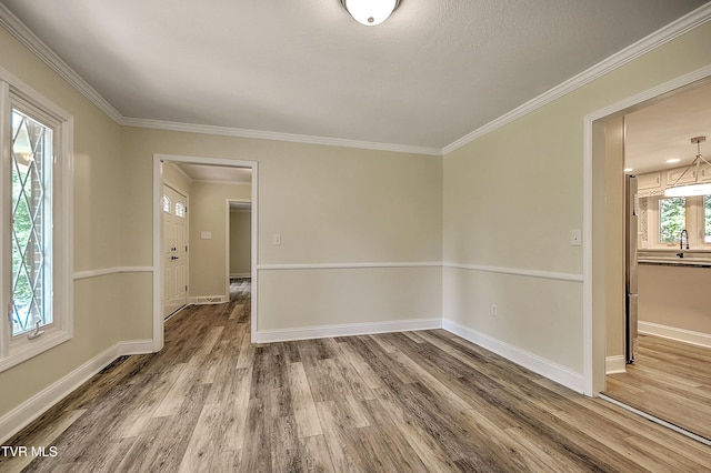 505 Red Oak Ln, Kingsport, TN 37663 - spare room with wood finished floors and ornamental molding