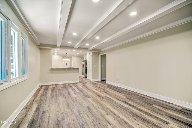 505 Red Oak Ln, Kingsport, TN 37663 - unfurnished living room featuring beam ceiling, light wood-style floors, plenty of natural light, and recessed lighting
