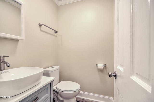 505 Red Oak Ln, Kingsport, TN 37663 - half bathroom with ornamental molding, vanity, and wood finished floors
