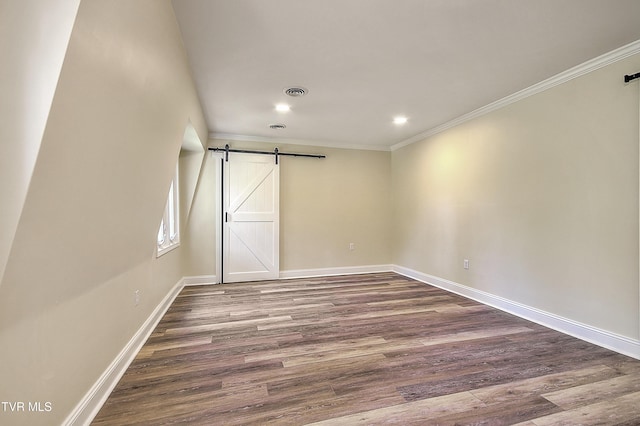 505 Red Oak Ln, Kingsport, TN 37663 - unfurnished bedroom featuring a barn door, wood finished floors, ornamental molding, and recessed lighting