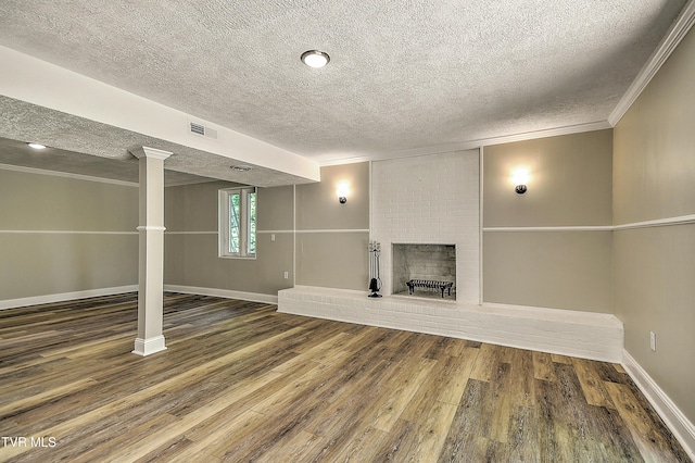 505 Red Oak Ln, Kingsport, TN 37663 - below grade area with a textured ceiling, wood finished floors, a fireplace, and crown molding