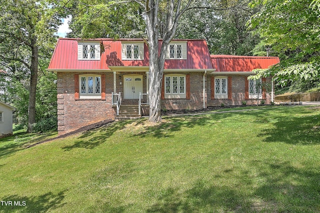 505 Red Oak Ln, Kingsport, TN 37663 - view of front facade featuring a front yard, brick siding, and a metal roof