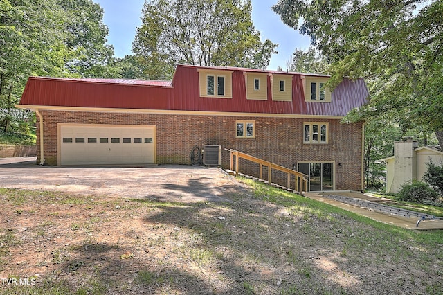 505 Red Oak Ln, Kingsport, TN 37663 - view of front of property featuring a metal roof, driveway, brick siding, and an attached garage