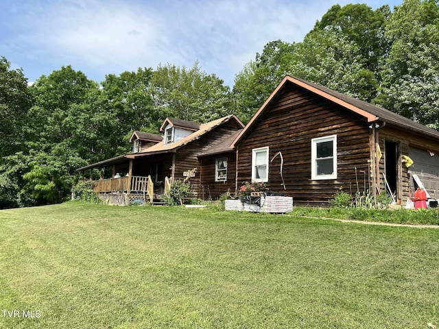 12615 Star Branch Rd, Coeburn, VA 24230 - back of house featuring a yard and a garage