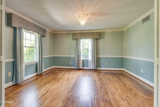 421 High Ridge Rd, Kingsport, TN 37660 - empty room with a chandelier, wood finished floors, baseboards, and crown molding