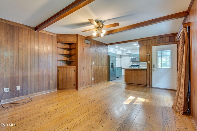 421 High Ridge Rd, Kingsport, TN 37660 - unfurnished living room featuring wood walls, light wood finished floors, a ceiling fan, beam ceiling, and crown molding