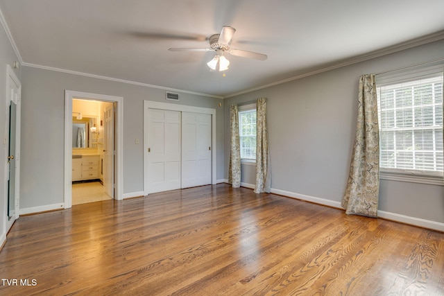 421 High Ridge Rd, Kingsport, TN 37660 - unfurnished bedroom featuring wood finished floors, baseboards, a closet, ornamental molding, and a ceiling fan