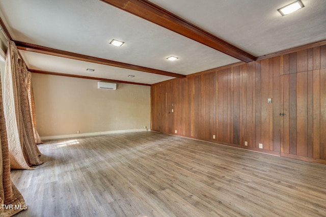 421 High Ridge Rd, Kingsport, TN 37660 - spare room with beam ceiling, wood finished floors, a wall mounted air conditioner, wooden walls, and baseboards