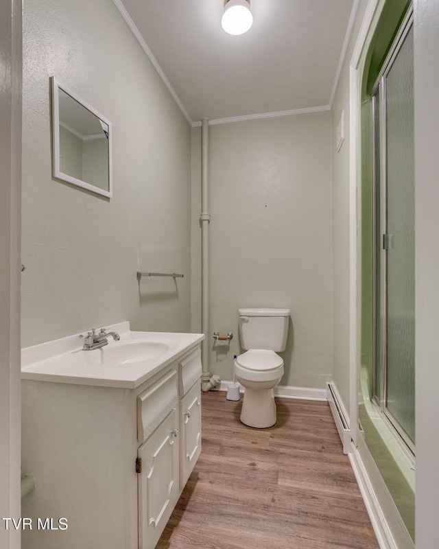 421 High Ridge Rd, Kingsport, TN 37660 - bathroom featuring baseboard heating, wood finished floors, crown molding, a shower with shower door, and vanity