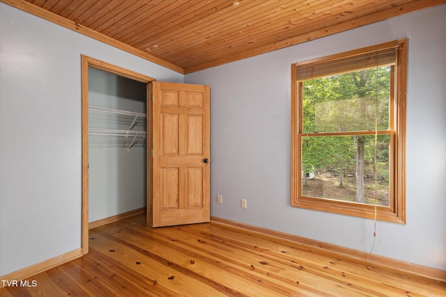 9245 Mendota Rd, Mendota, VA 24270 - unfurnished bedroom with hardwood / wood-style floors, baseboards, wooden ceiling, and a closet