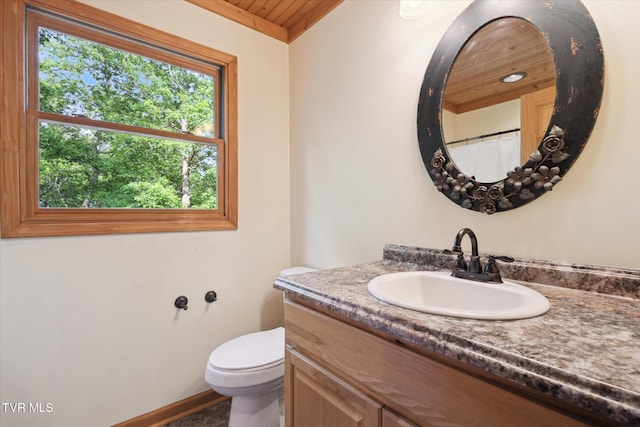 9245 Mendota Rd, Mendota, VA 24270 - bathroom featuring vanity, toilet, wooden ceiling, baseboards, and curtained shower
