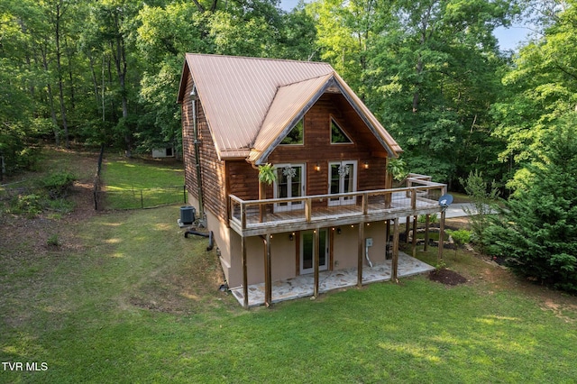 9245 Mendota Rd, Mendota, VA 24270 - back of property featuring a wooden deck, a yard, central AC, and stucco siding