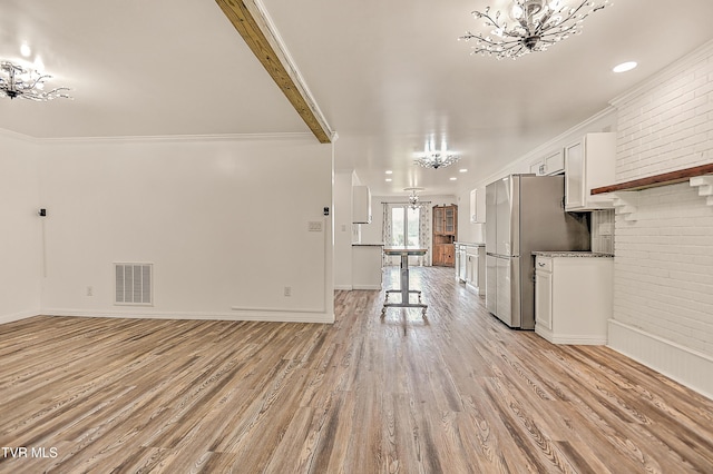 14191 King Mill Pike, Bristol, VA 24202 - unfurnished living room with a chandelier, light wood-style floors, crown molding, baseboards, and recessed lighting