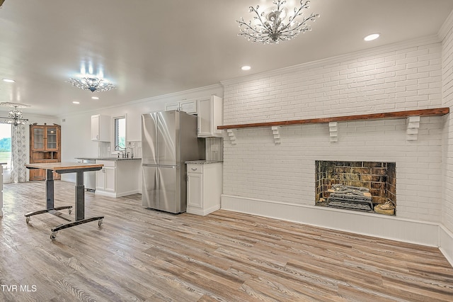 14191 King Mill Pike, Bristol, VA 24202 - kitchen with a chandelier, appliances with stainless steel finishes, white cabinets, ornamental molding, and recessed lighting