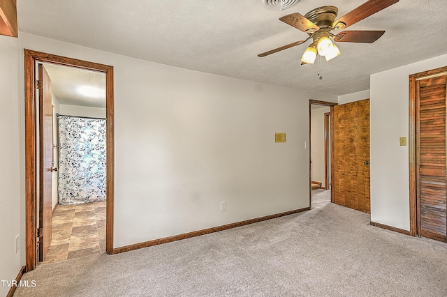 14191 King Mill Pike, Bristol, VA 24202 - unfurnished bedroom featuring light colored carpet, baseboards, a textured ceiling, and ceiling fan