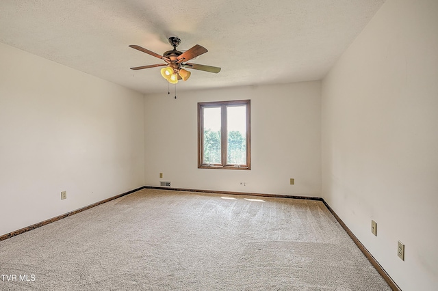 14191 King Mill Pike, Bristol, VA 24202 - spare room featuring carpet floors, a ceiling fan, baseboards, and a textured ceiling