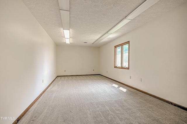 14191 King Mill Pike, Bristol, VA 24202 - empty room featuring light carpet, baseboards, and a textured ceiling