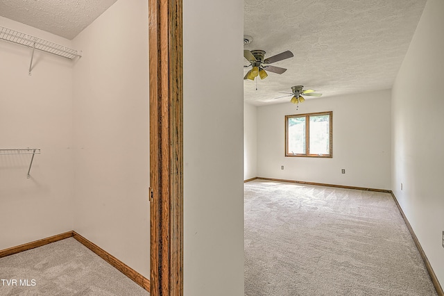 14191 King Mill Pike, Bristol, VA 24202 - spare room with carpet flooring, a textured ceiling, ceiling fan, and baseboards