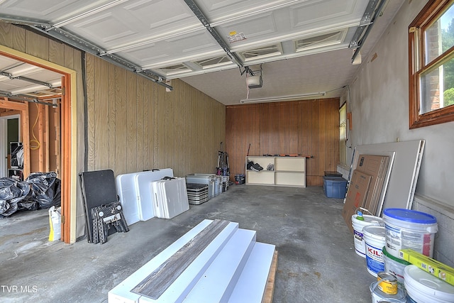 14191 King Mill Pike, Bristol, VA 24202 - garage with wooden walls and a garage door opener