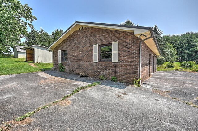 14191 King Mill Pike, Bristol, VA 24202 - view of home's exterior with brick siding and a lawn