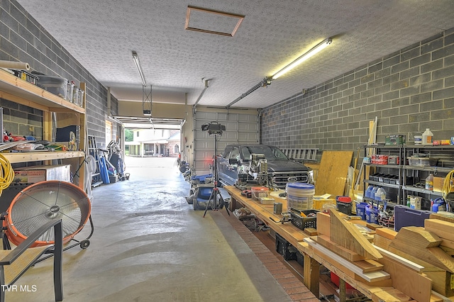 14191 King Mill Pike, Bristol, VA 24202 - garage featuring a workshop area and concrete block wall