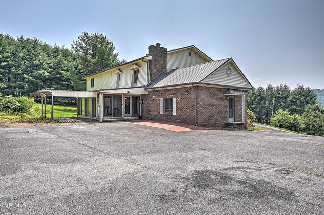 14191 King Mill Pike, Bristol, VA 24202 - view of side of home with brick siding and a chimney