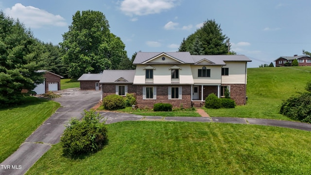 14191 King Mill Pike, Bristol, VA 24202 - view of front of house featuring brick siding, an outdoor structure, a front lawn, metal roof, and a garage