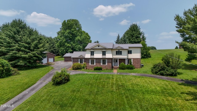 14191 King Mill Pike, Bristol, VA 24202 - view of front of home with an outbuilding, a front lawn, a garage, and brick siding