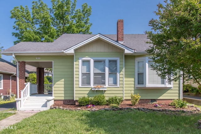 915 Lawrence Ave, Bristol, VA 24201 - bungalow-style home with a chimney, a front lawn, roof with shingles, and a porch