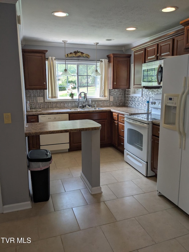 1319 5th St, Bristol, TN 37620 - kitchen with white appliances, a sink, backsplash, pendant lighting, and recessed lighting
