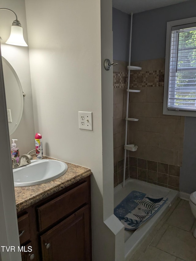 1319 5th St, Bristol, TN 37620 - full bathroom featuring vanity, a shower stall, tile patterned flooring, and toilet