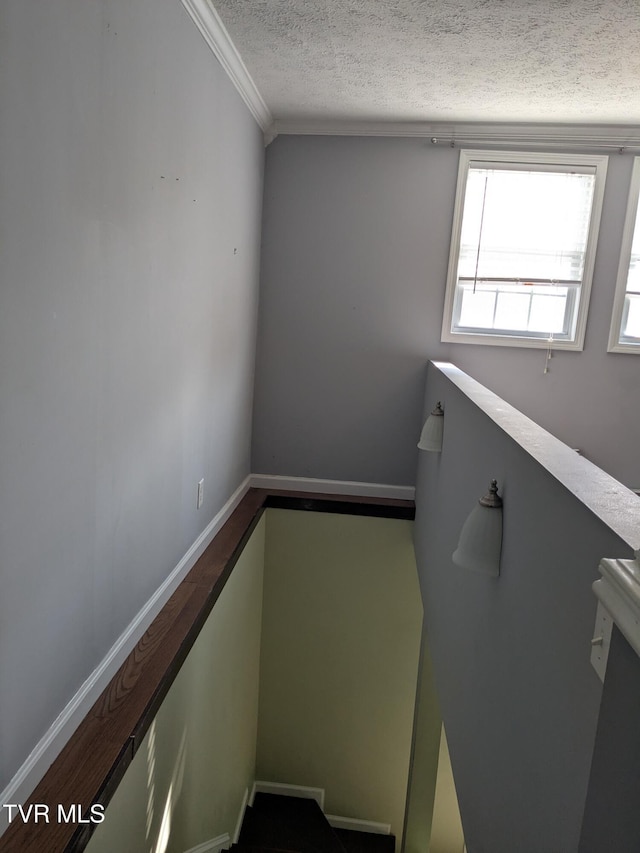 1319 5th St, Bristol, TN 37620 - staircase featuring a textured ceiling and crown molding