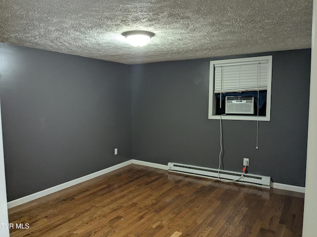 1319 5th St, Bristol, TN 37620 - spare room featuring a baseboard heating unit, cooling unit, wood finished floors, a textured ceiling, and baseboards