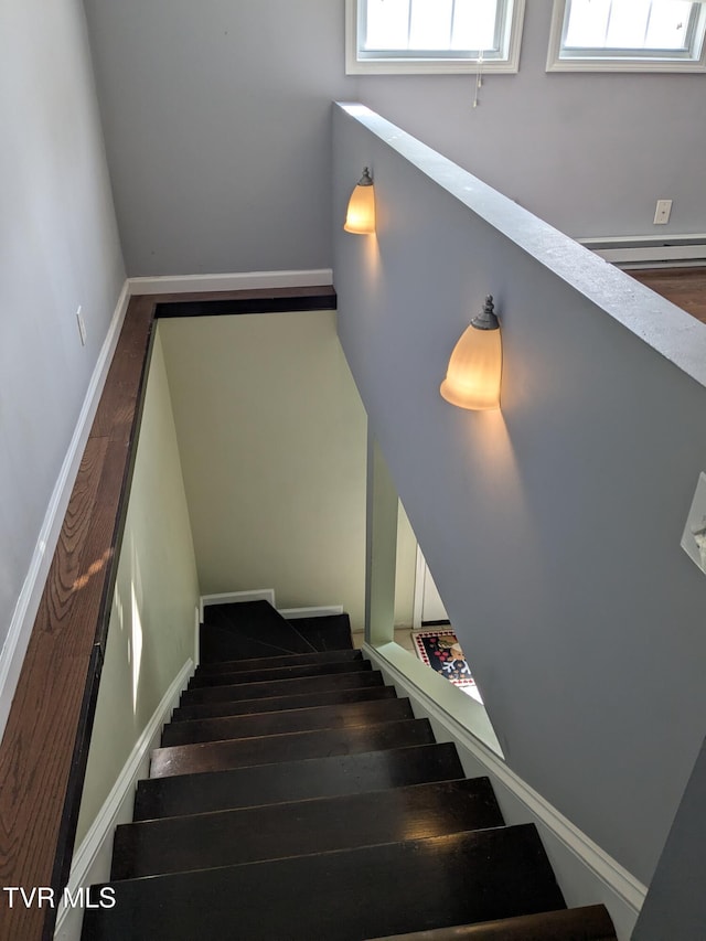 1319 5th St, Bristol, TN 37620 - stairway featuring a baseboard heating unit, baseboards, and wood finished floors