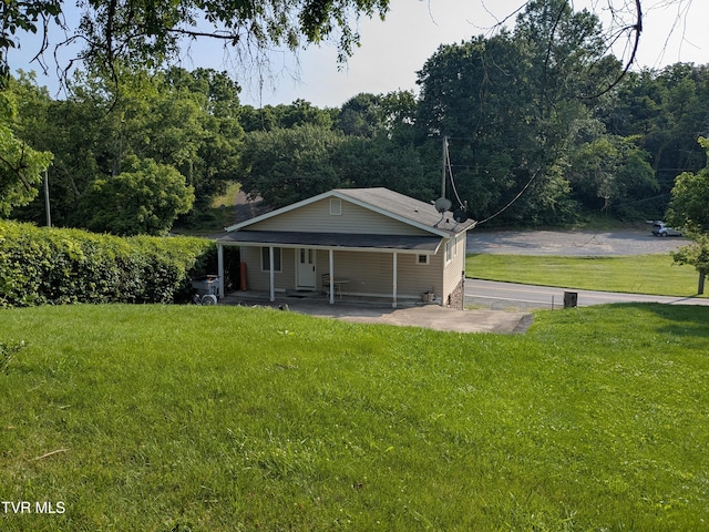 1319 5th St, Bristol, TN 37620 - back of house with a yard and a porch
