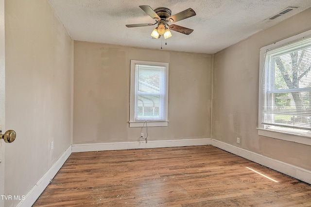 1725 Highland St, Kingsport, TN 37664 - unfurnished room with wood finished floors, a textured ceiling, baseboards, and ceiling fan