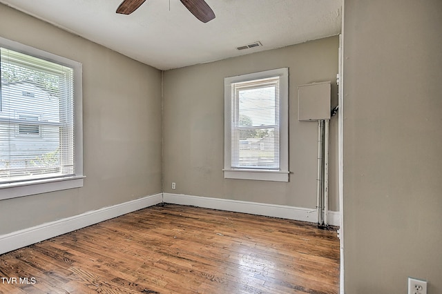 1725 Highland St, Kingsport, TN 37664 - spare room featuring healthy amount of natural light, wood finished floors, and baseboards