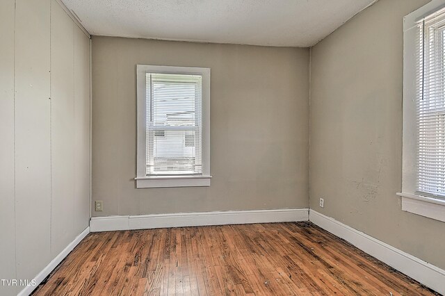 1725 Highland St, Kingsport, TN 37664 - spare room featuring hardwood / wood-style floors and baseboards