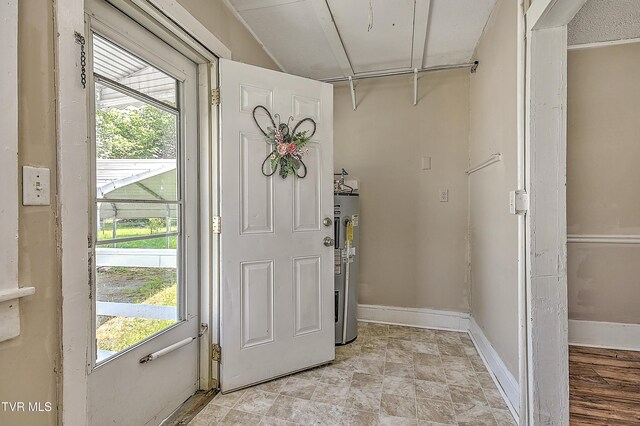 1725 Highland St, Kingsport, TN 37664 - foyer entrance featuring electric water heater, healthy amount of natural light, and baseboards
