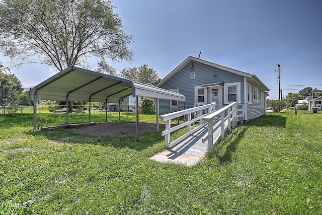 1725 Highland St, Kingsport, TN 37664 - rear view of house with a detached carport and driveway