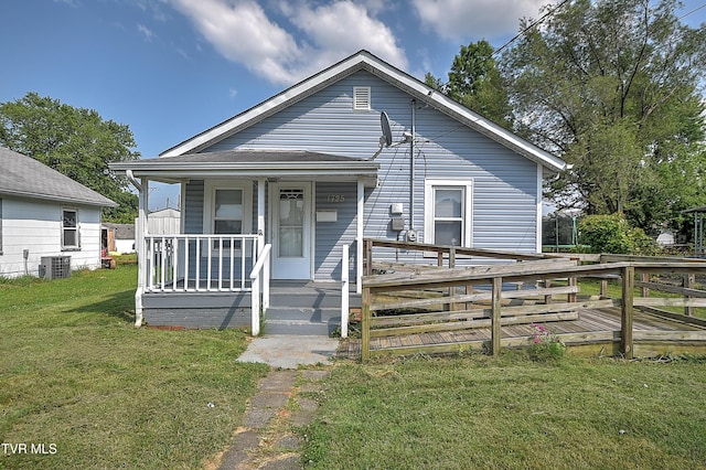 1725 Highland St, Kingsport, TN 37664 - shotgun-style home with a front lawn, a porch, and cooling unit