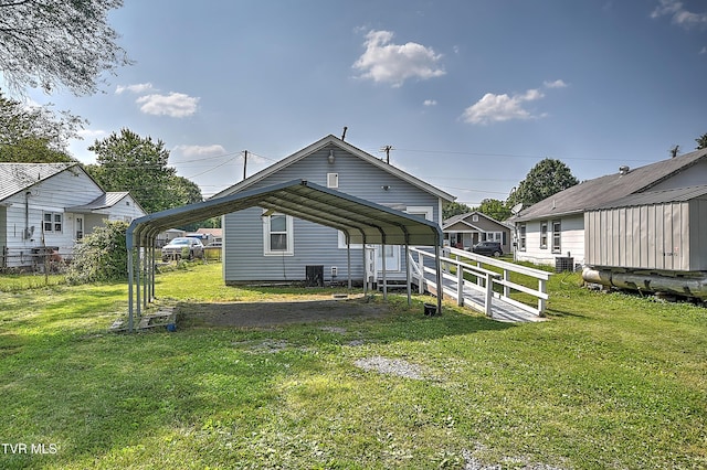 1725 Highland St, Kingsport, TN 37664 - back of property with a carport, driveway, and central air condition unit