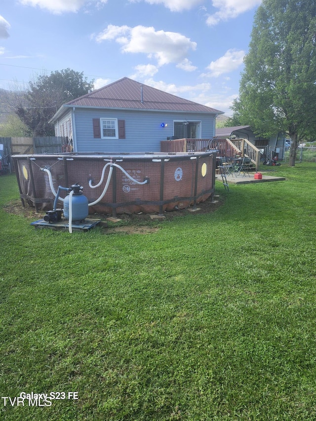 127 Banner St, Erwin, TN 37650 - back of house featuring metal roof and an outdoor pool